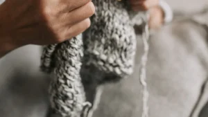 Modern knitting techniques and trends including hand knitting and knitting machines