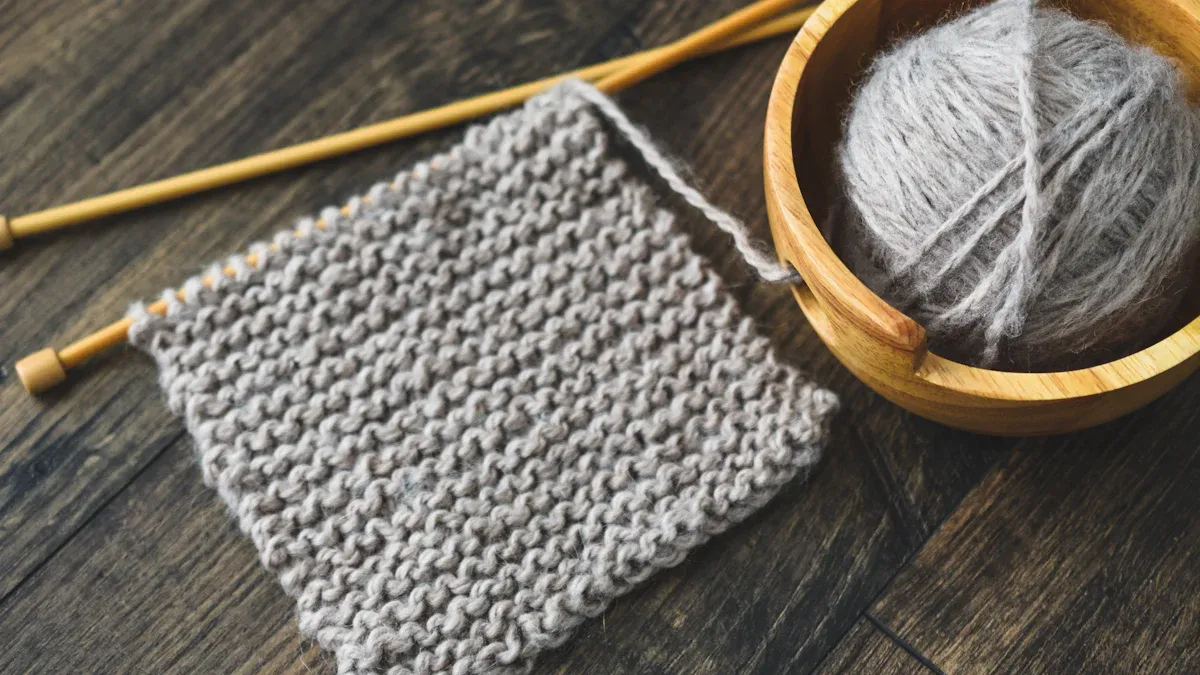 What is the garter stitch in knitting and why should beginners learn it