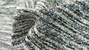 What is a Tweed-Effect Knit Cardigan and How Does It Differ from Traditional Tweed